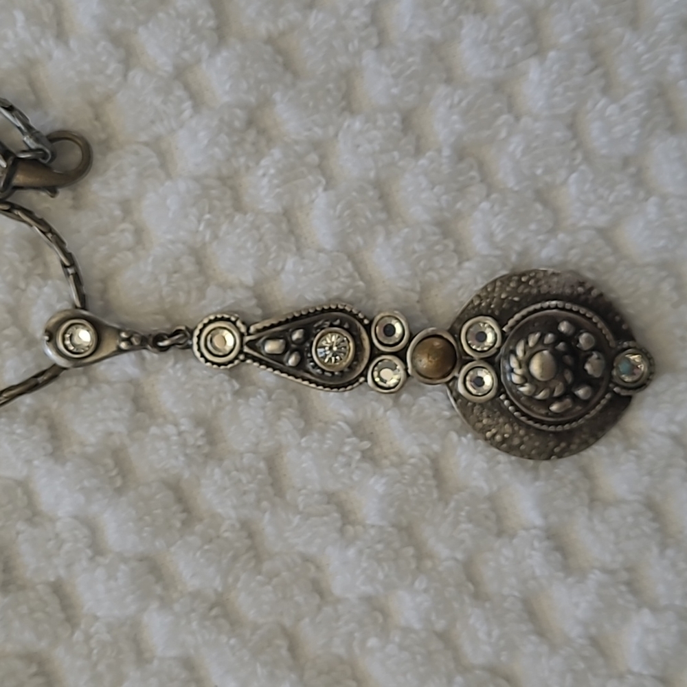 Vintage pewter tone 32 inch necklace with 3 1/2 inch pendant with crystals.